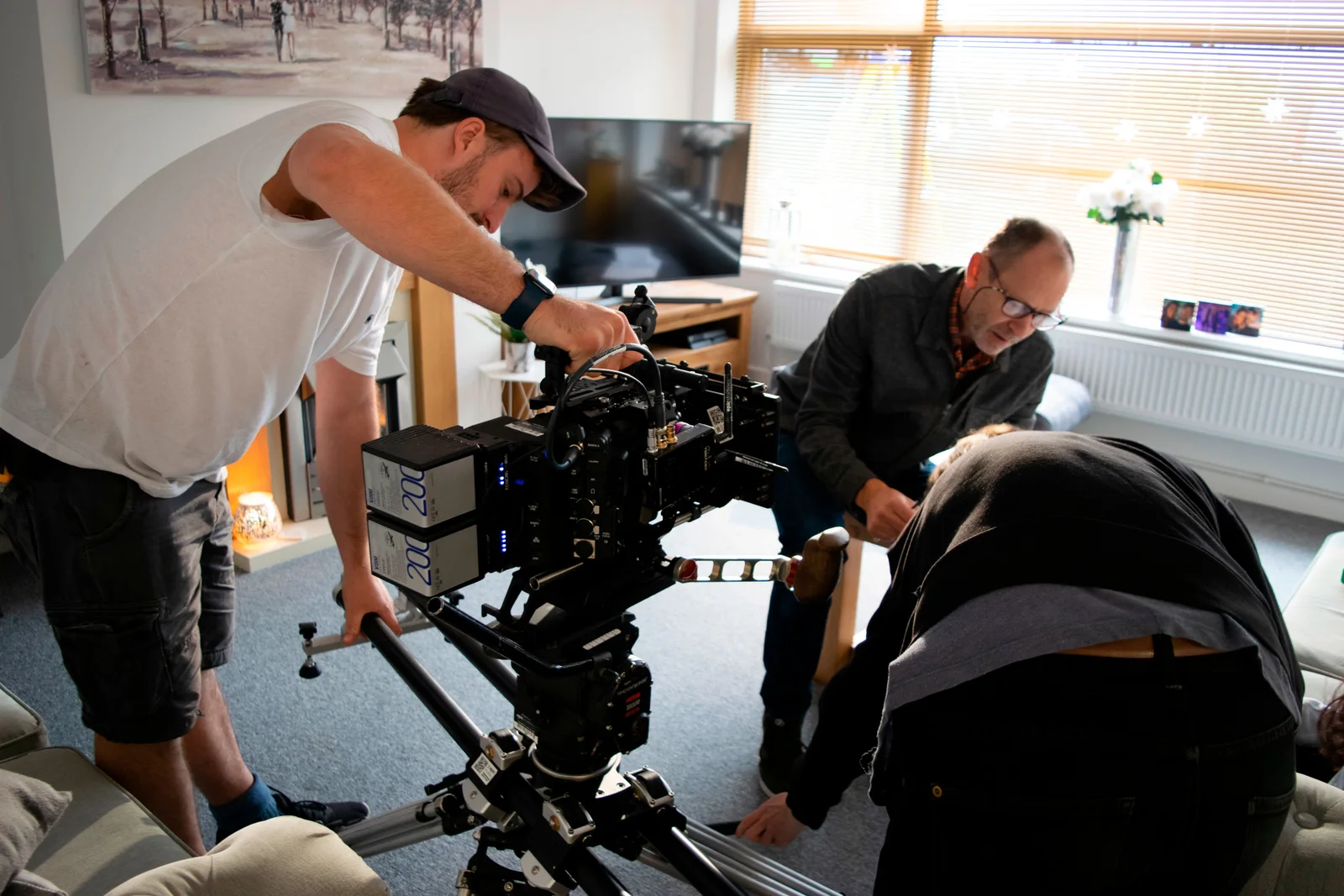 Epic production crew setting up a cinema camera on location